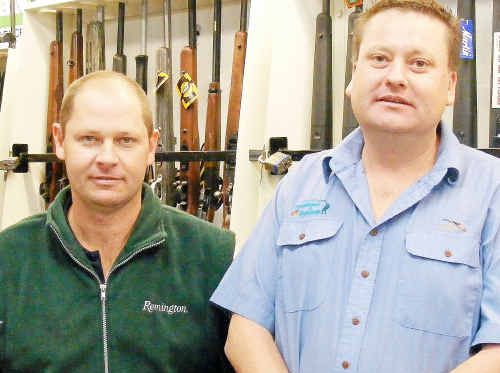 Not happy: Warwick Outdoors and Sports owners John Bacon and Wayne Eastwell are unhappy with the 124 per cent hike in weapons licence fees, announced Tuesday. Not happy: Warwick Outdoors and Sports owners John Bacon and Wayne Eastwell are unhappy with the 124 per cent hike in weapons licence fees, announced Tuesday.